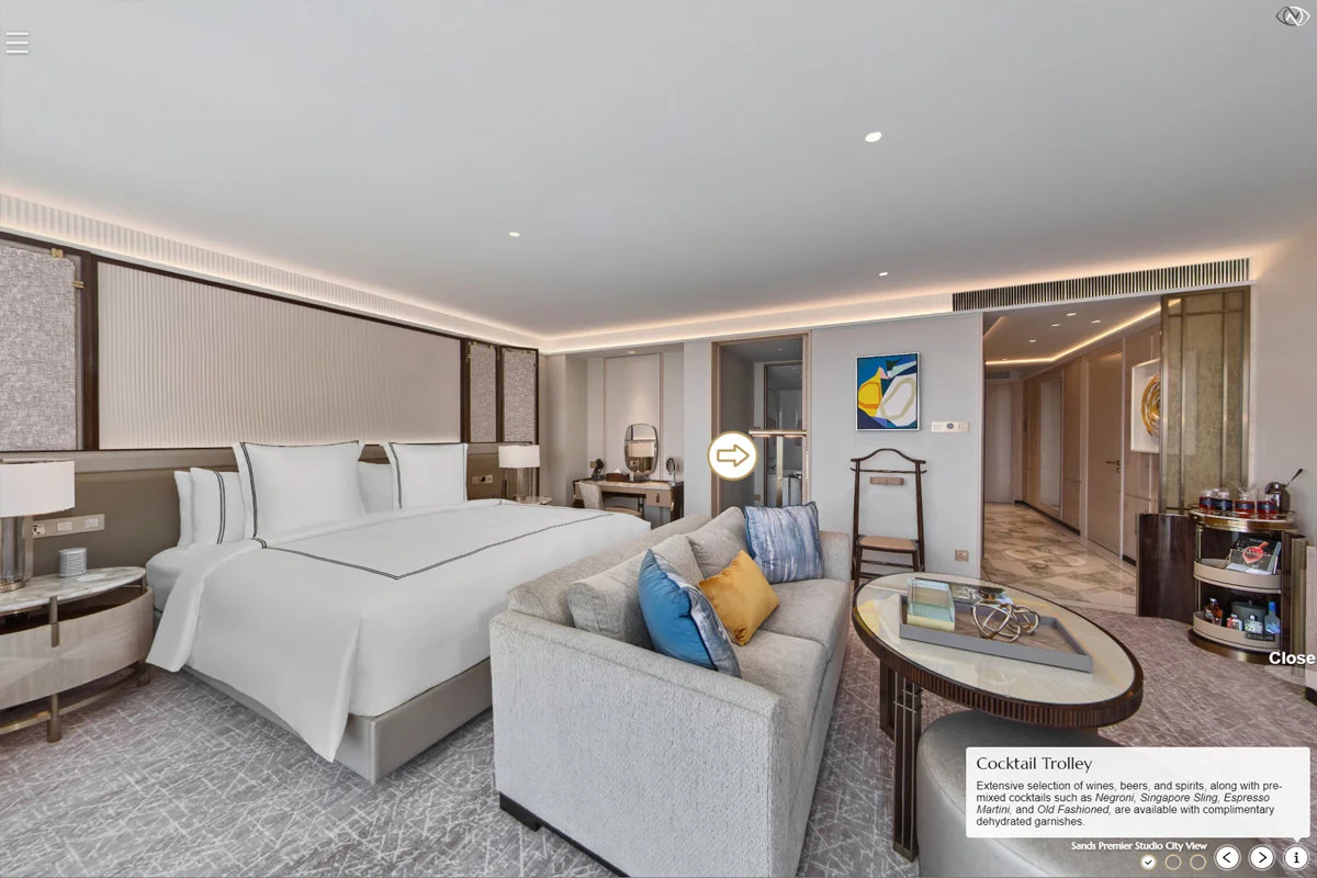 Sands Premier Studio City View room with king bed, sofa, cocktail trolley, and modern decor Singapore