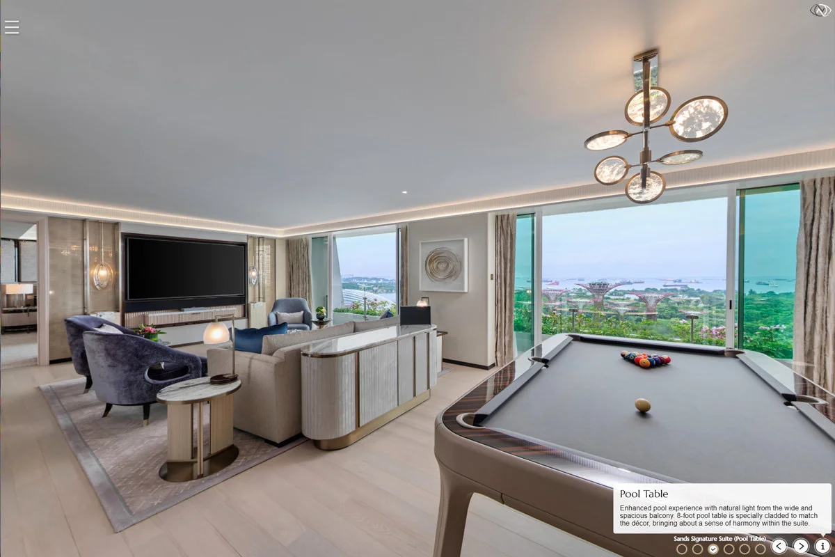 Sands Signature Suite pool table room with lounge seating, large TV, and Gardens by the Bay views