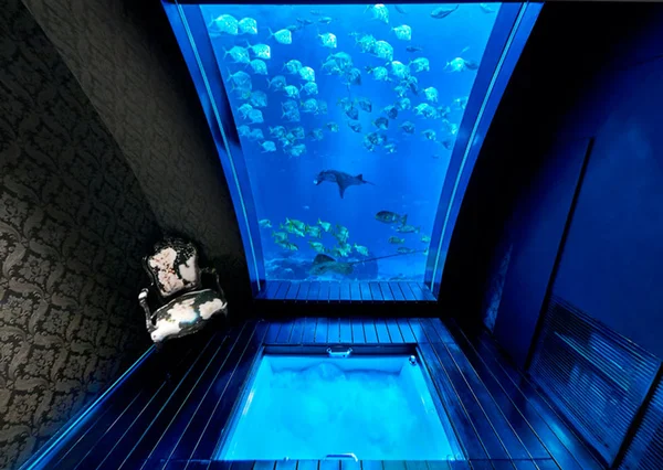 Luxury hotel room virtual tour at Equarius Hotel Singapore Ocean Suite with textured headboard and glass bathroom